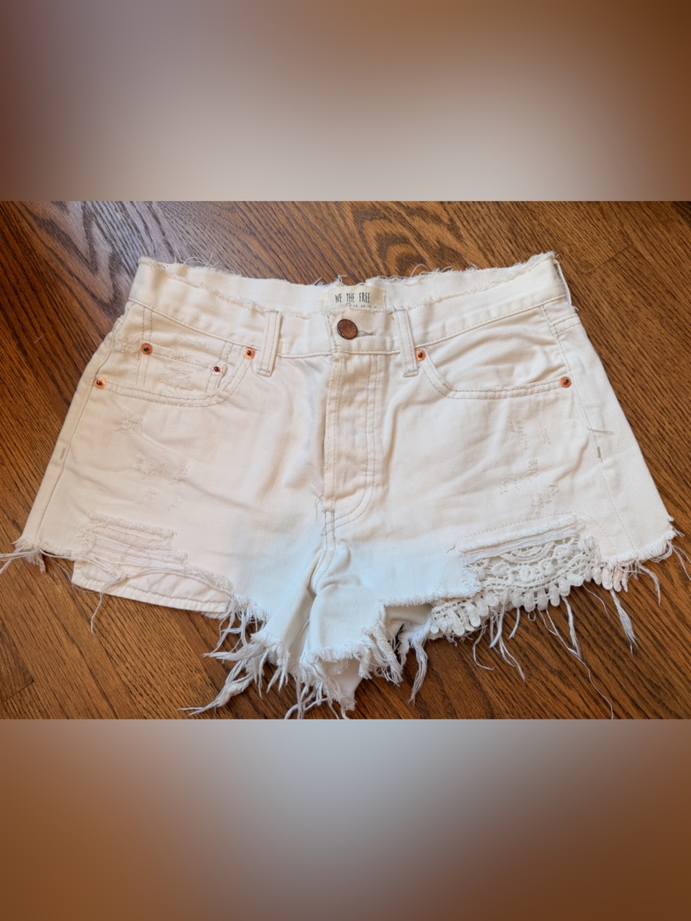 We The Free White Distressed Crochet-Trim Denim Shorts